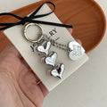 Silver heart beaded bag charm